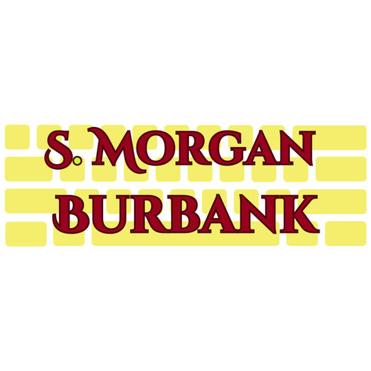 A yellow blank keyboard with red text atop it in swooping serif font. The text reads "S. Morgan Burbank"